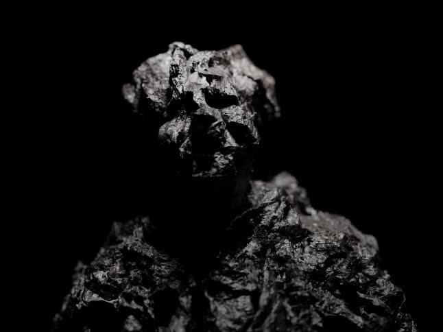 The statue of a man begins to melt