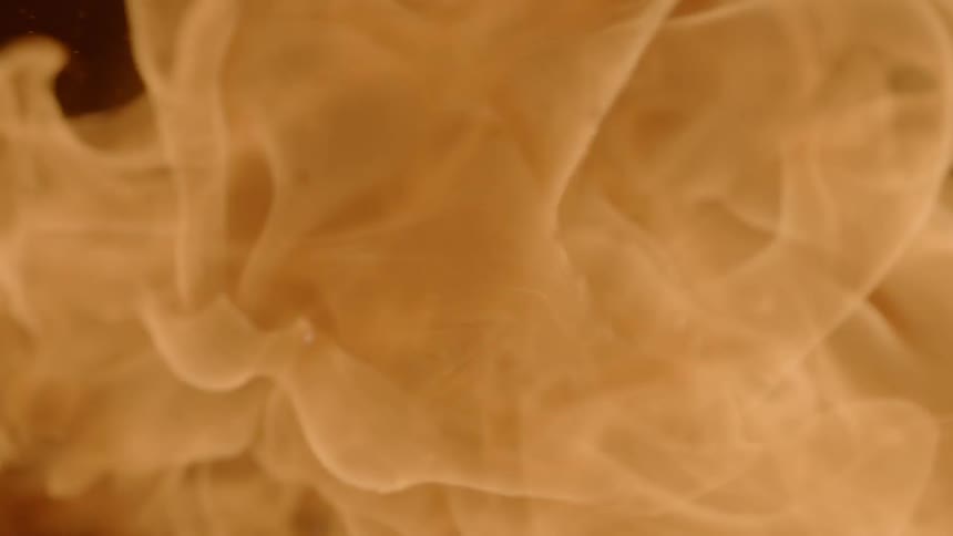 A flame shoots upwards