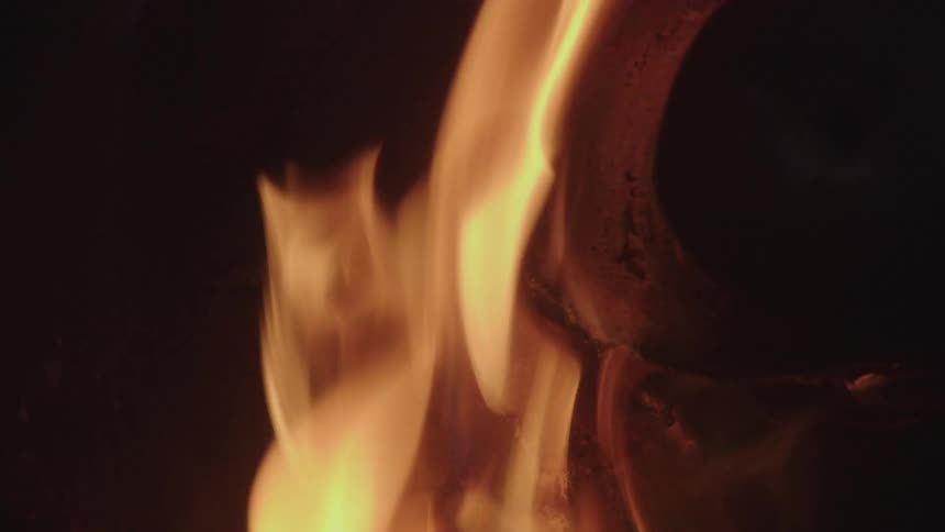 Flames flicker on the pig head