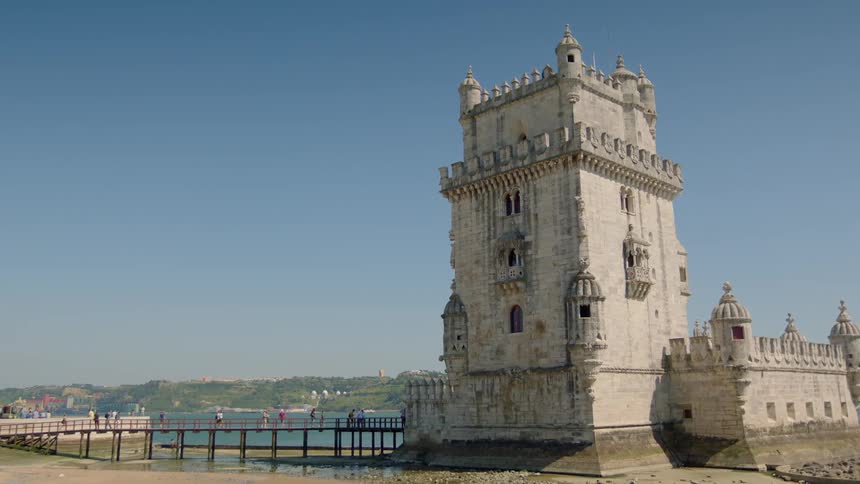 A stone building stands tall on a clear day