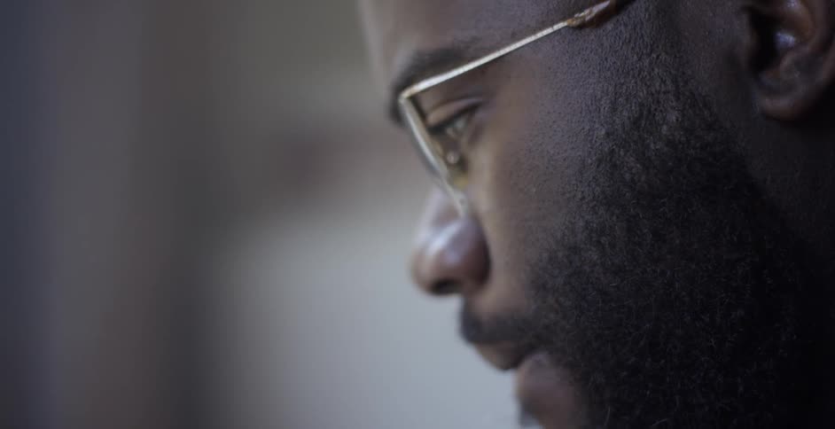 Man with glasses concentrating