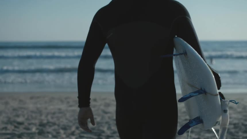 A person holding a surfboard