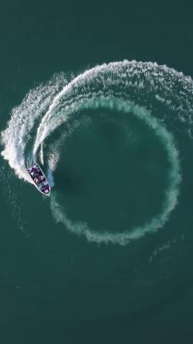 Boat circling in an ocean