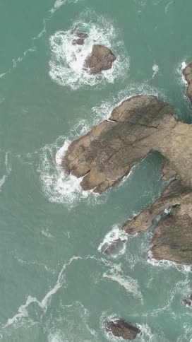Waves are crashing against the rocks