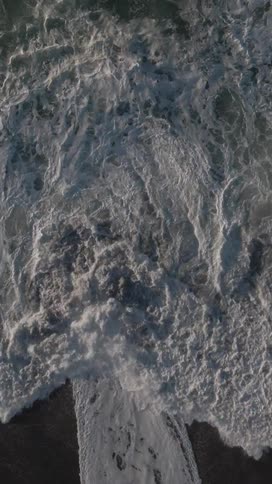 The tide slowly moves over the sand of the beach