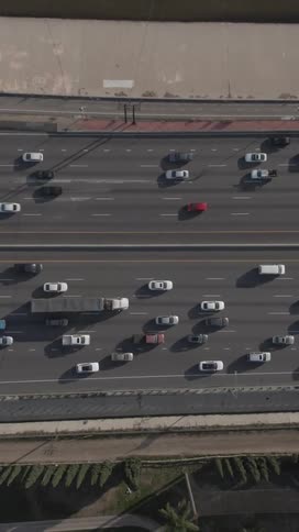 Topview of medium traffic on a twelve lane divided highway from a horizontal perspective during the day