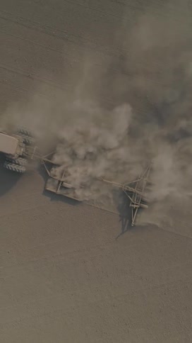 Dust is trailing behind the tractor