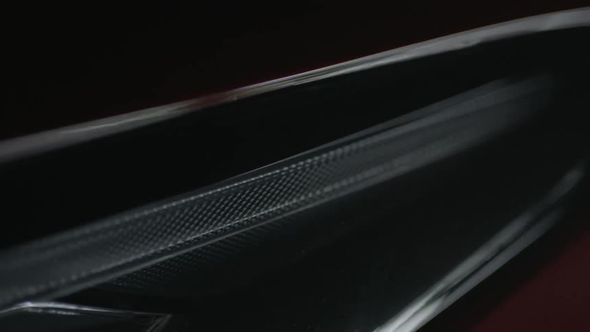 A painted metallic surface reflects light