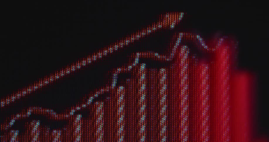 Macro close up of a red arrow that moves up across a pixelated screen as a financial trading graph is building beneath it symbolizing economic growth or rising stock prices or crypto currency trading as successful investment