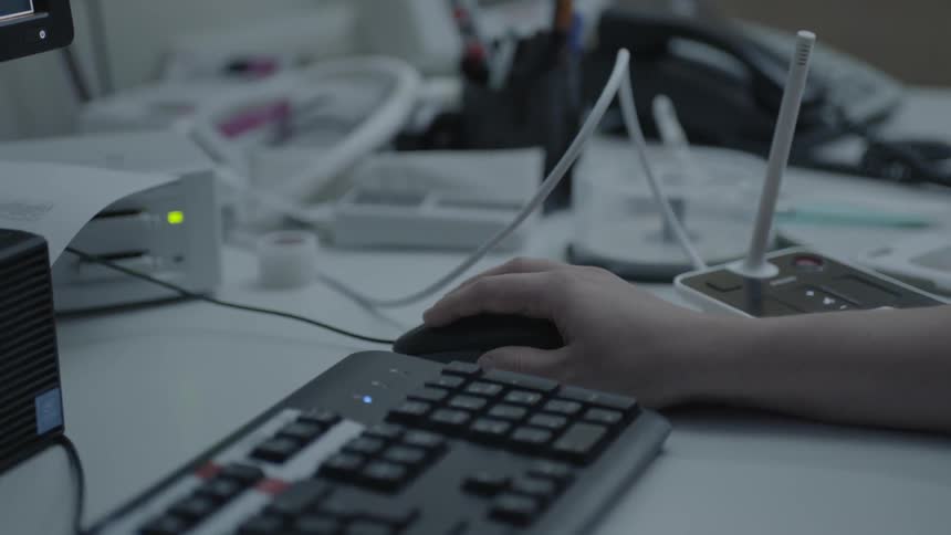 A person is using the mouse on a computer