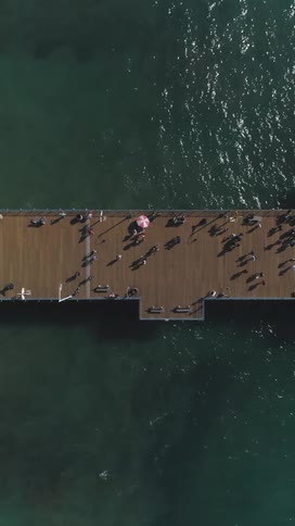 Aerial view of a pier with a crowd of people
