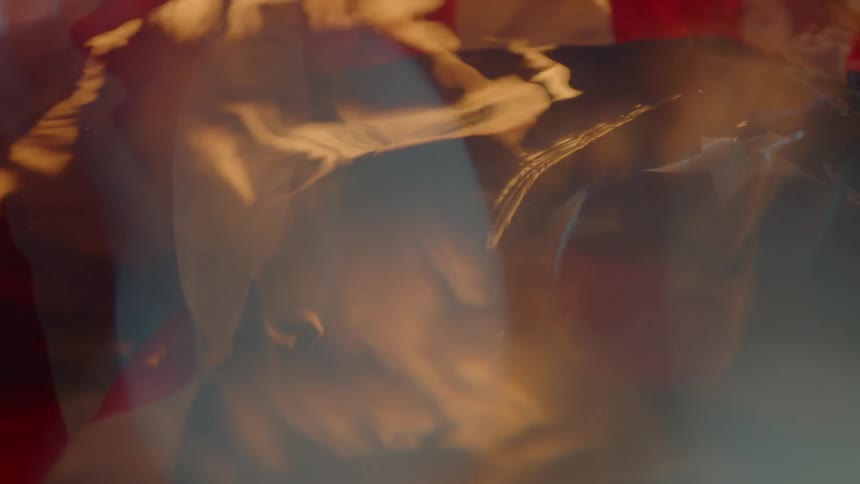 The reflection of a flag and flames