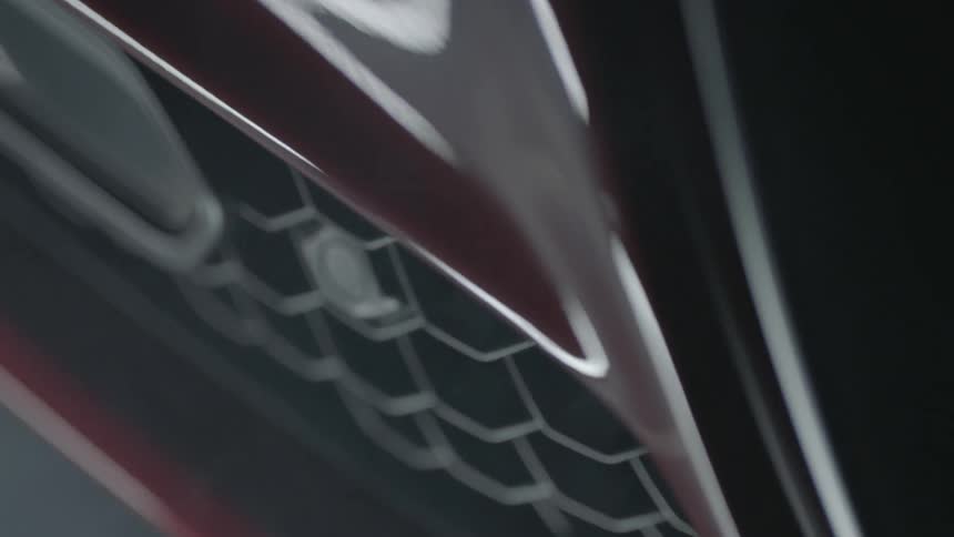 A painted metal surface reflects light