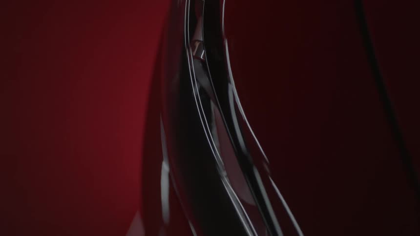 A painted metallic surface reflects light
