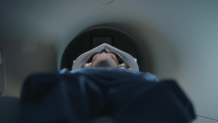 Person laying down going into a mri machine
