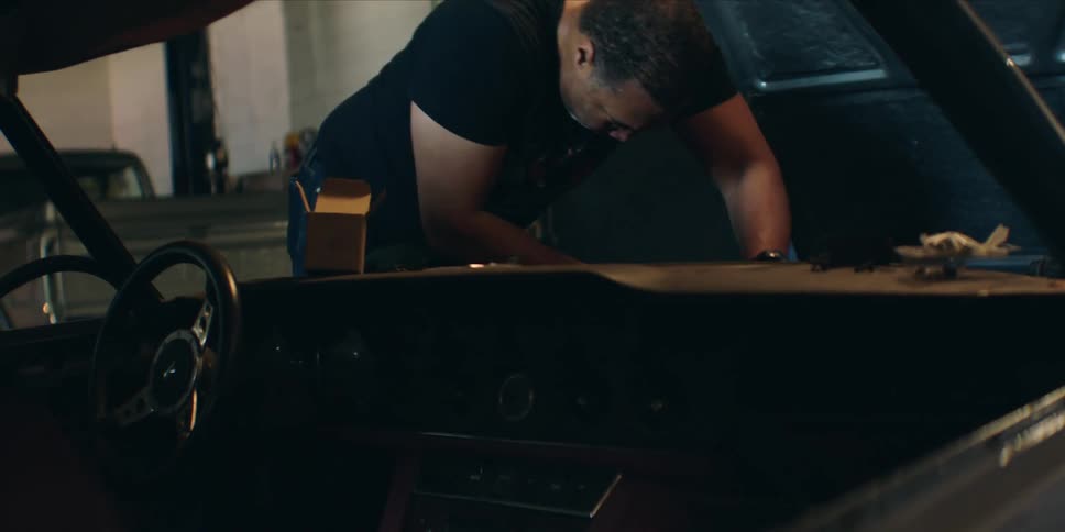 Mechanic working on a vehicle engine