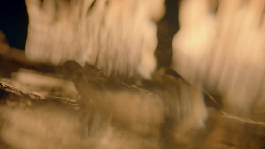 A hand splashes into water
