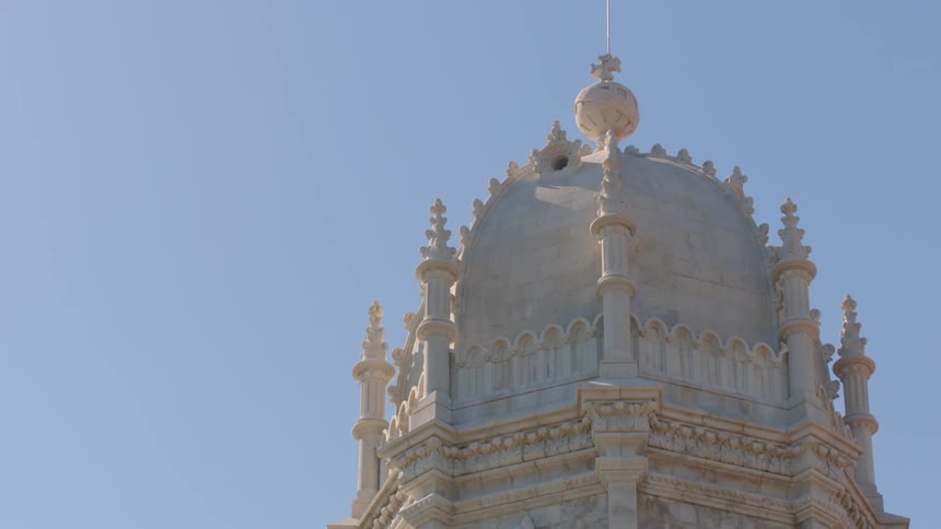 A tall down has a cross at the top