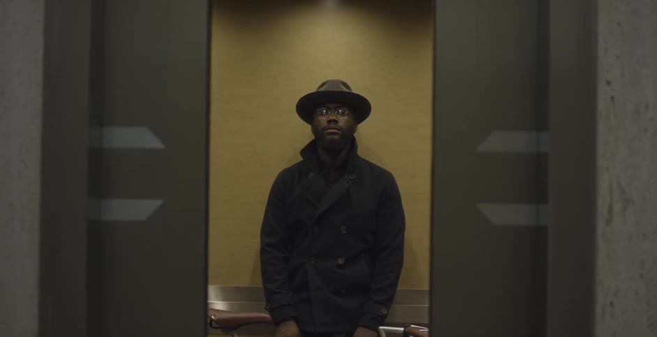 Man stands in an elevator as it closes