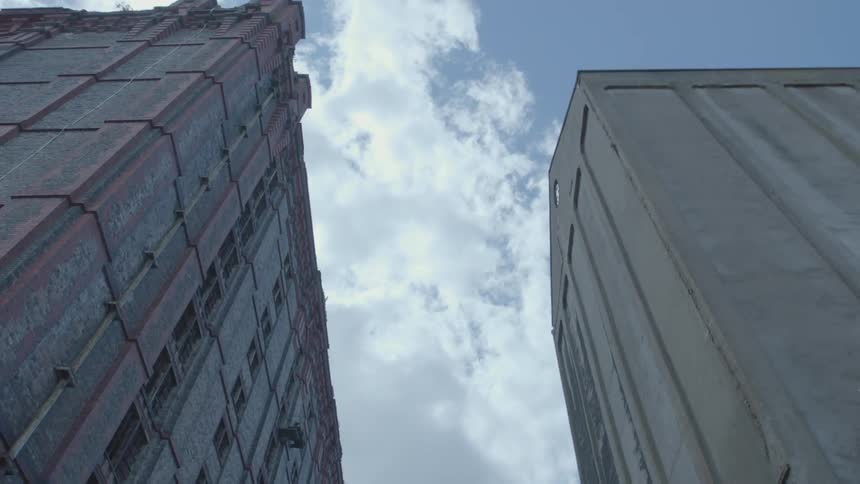 View looking upwards at tall buildings