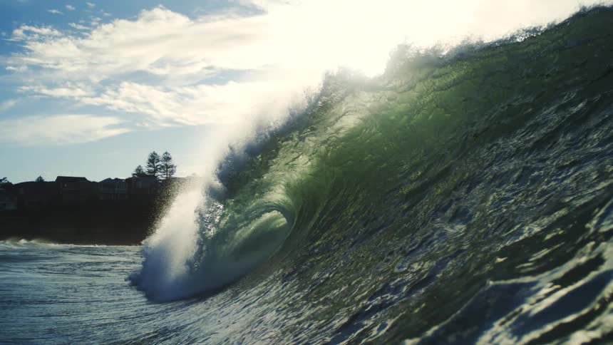 Barrel wave crashing in slow motion in the ocean