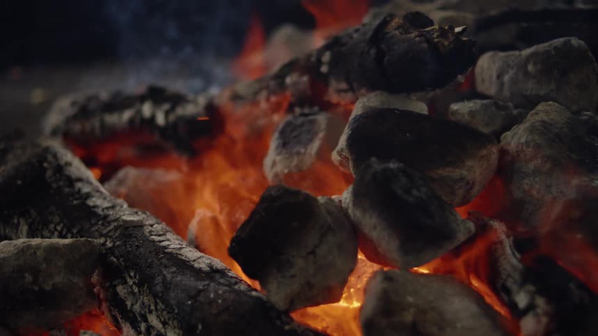 Charcoal burns in the flames