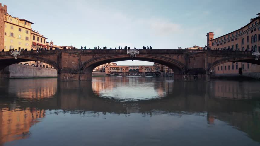 Tourists are standing on the bridge in the city