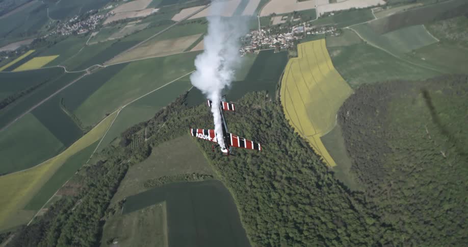 Single engine aircraft performing aerial maneuvers