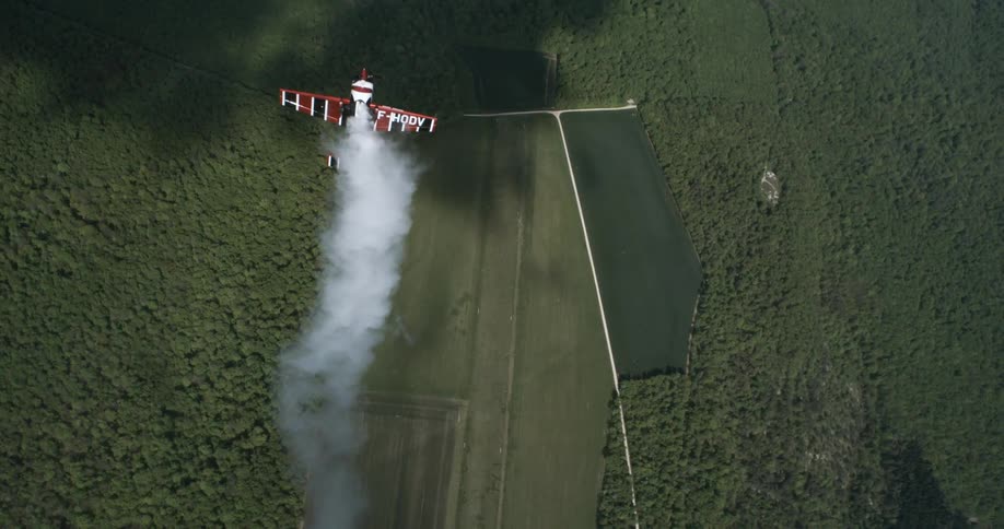 Small plane performing aerial maneuvers in a performance