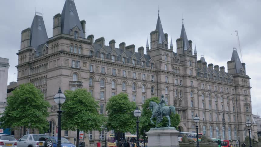 A large castle like buildings on a cloudy day