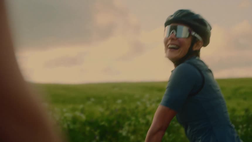 Female cyclist with sunglasses and helmet