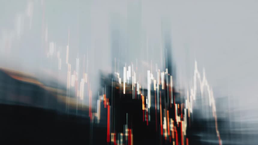 Reflection on a screen partially obscures a candlestick chart