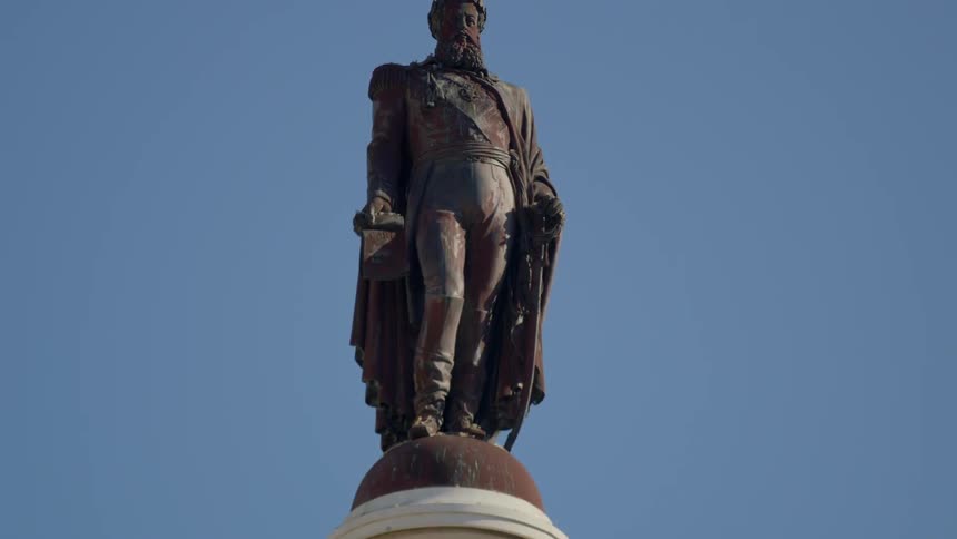 Statue of a man on a clear day
