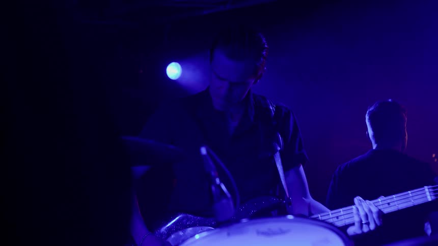 Musical band of guitarists in a performance