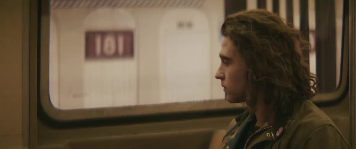 A man sits down in the train