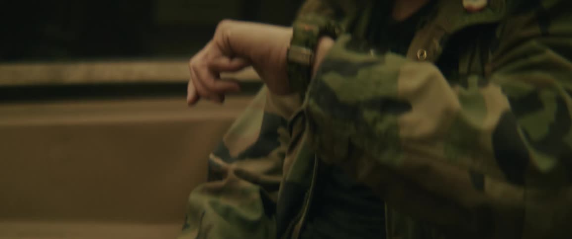 Man looking at his watch while on a moving train