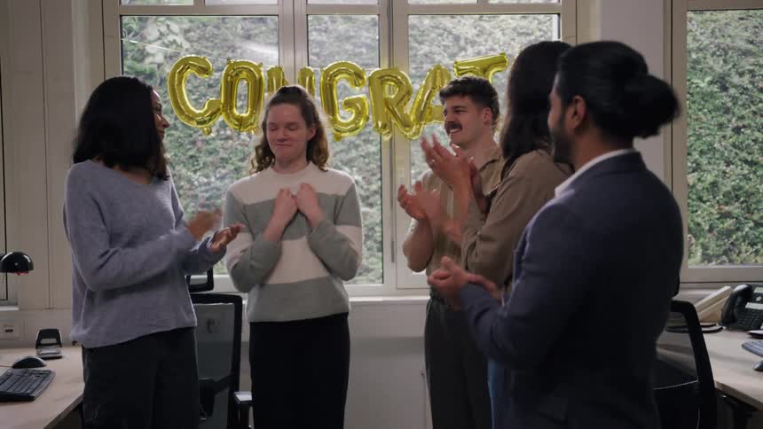 Coworkers are having a party in the office