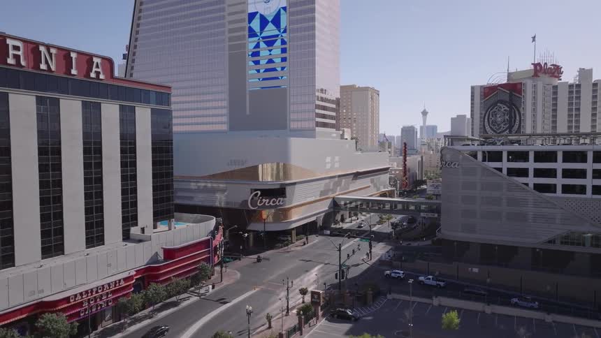 Casinos in downtown Las Vegas as cars pass by at midday
