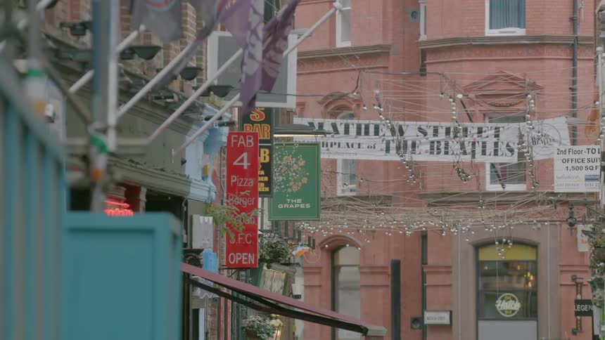 Flags and signs hang from building fronts