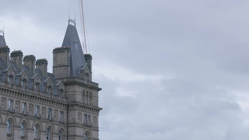 A building with many windows on a cloudy day
