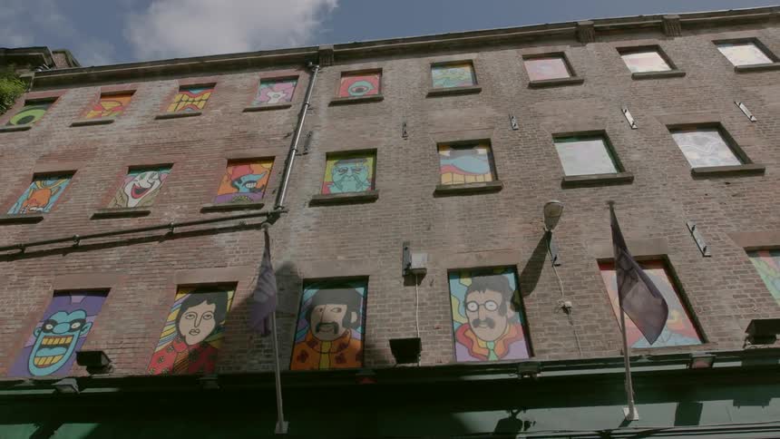 A building has graffiti on the windows