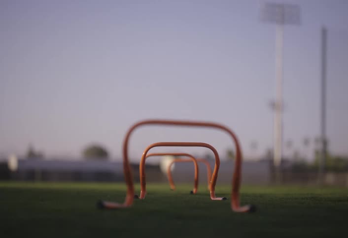 Training equipment displayed on a grass field in a stadium