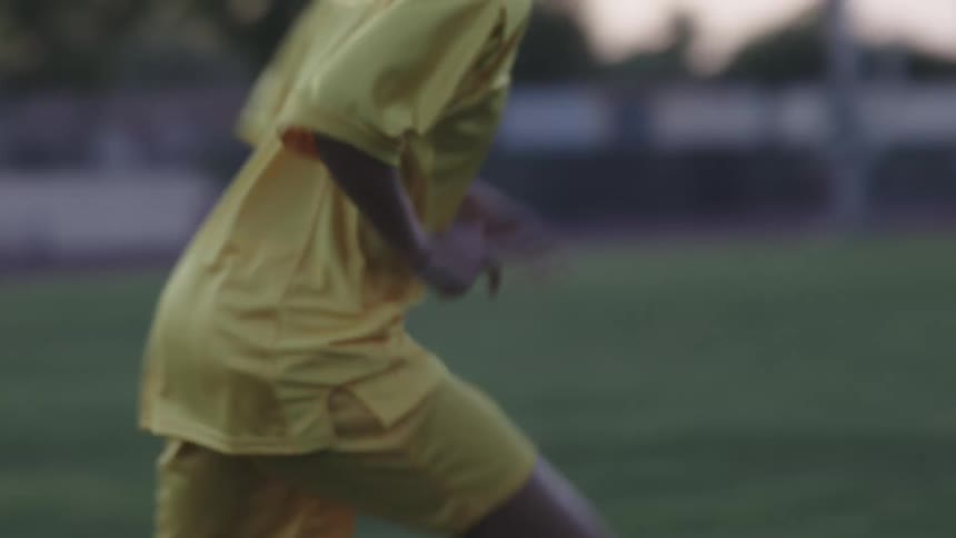 A soccer player does exercises on the field