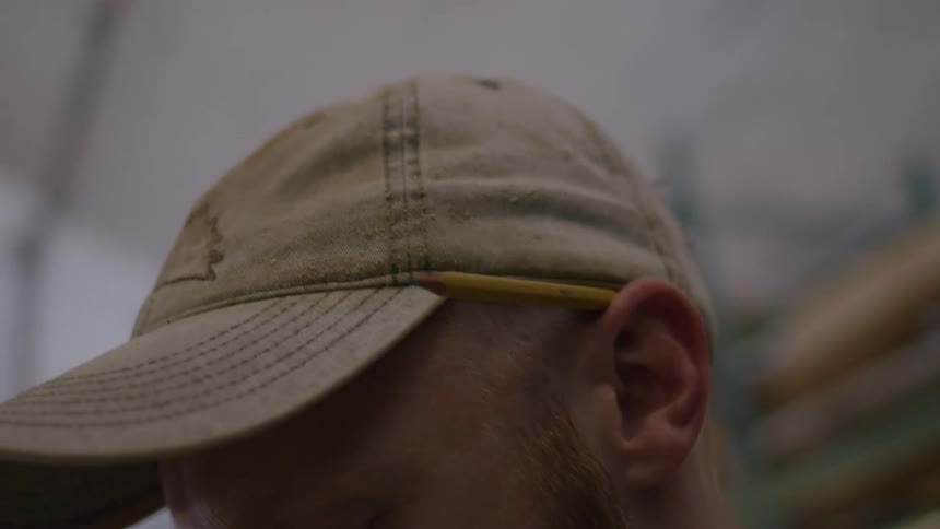 The man is using a pencil