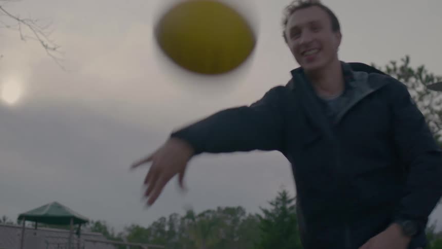 A man plays tetherball