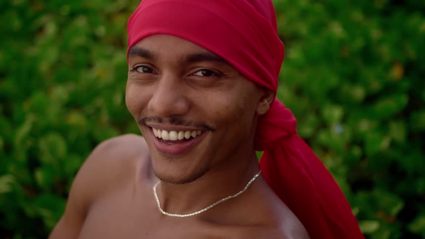 A man smiles at the camera