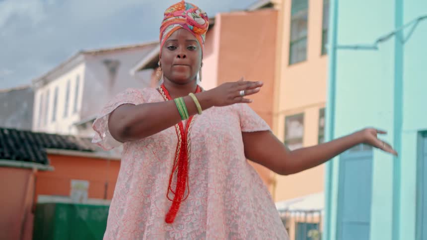 The woman is dancing outside