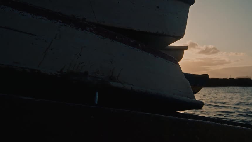 Boats are stacked by the dock
