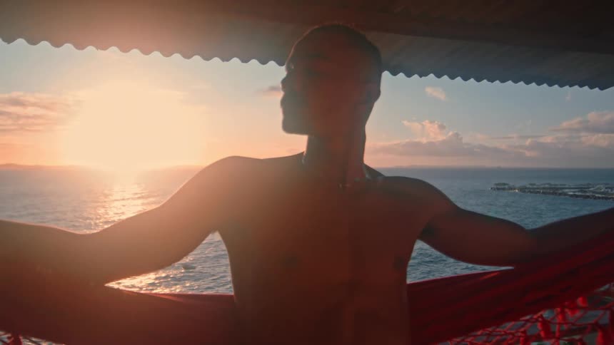 A man sits in a hammock