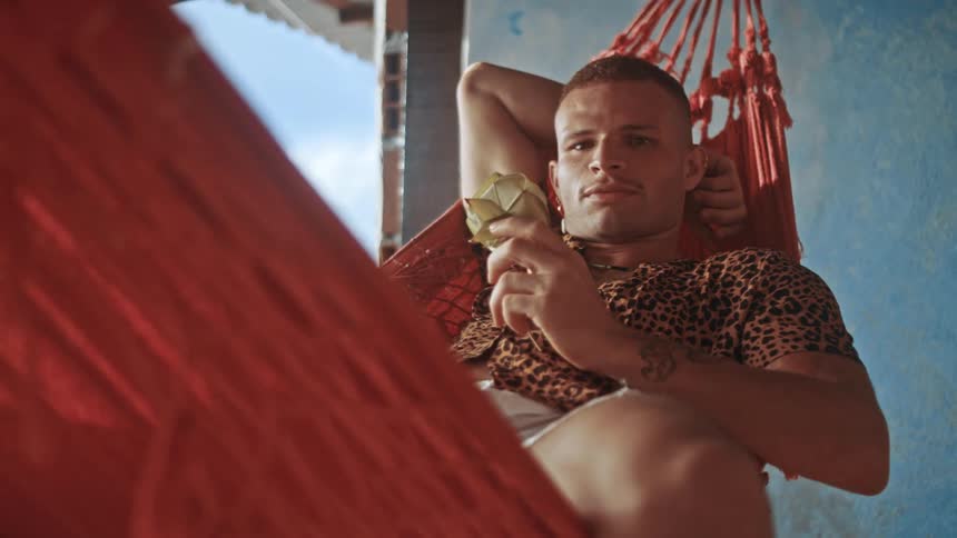 A man relaxes in a hammock